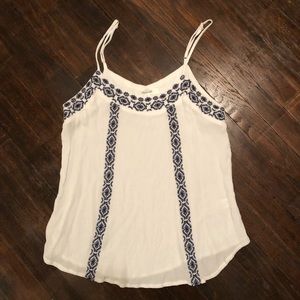 White blouse with blue stitching